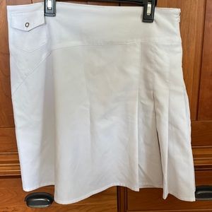 White golf tennis skirt flattering side zip with pleats on side 1 snap front